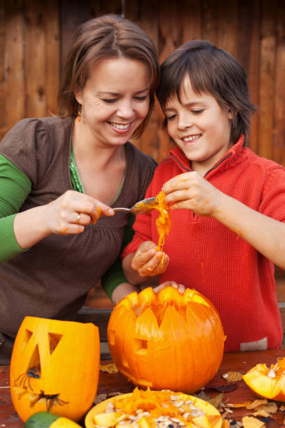 istock Fun time carving a jack-o-lantern for Halloween 1199451020