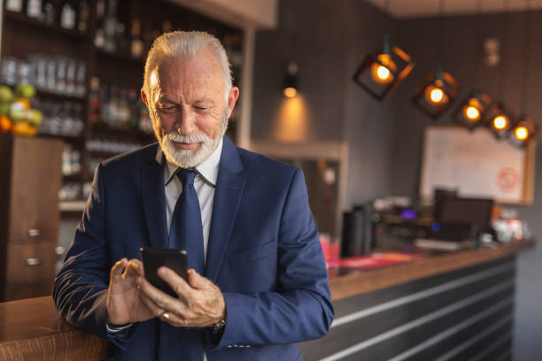 istock Senior businessman using a smart phone 1199451499
