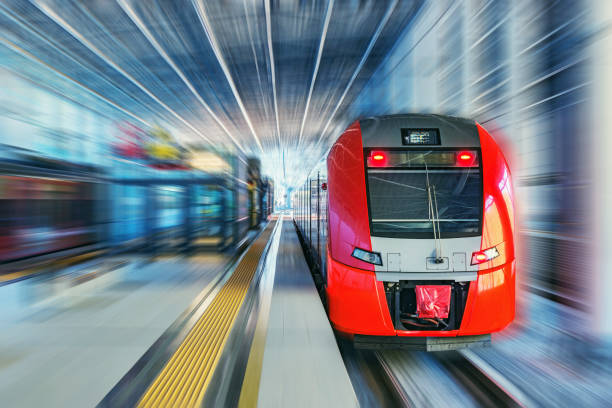 istock Passenger high speed train moves fast along the railway station platform. 1199452836