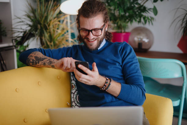 istock Millennial man shopping online 1199453924