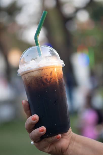 istock Thai iced black coffee signature local in hand 1199454902