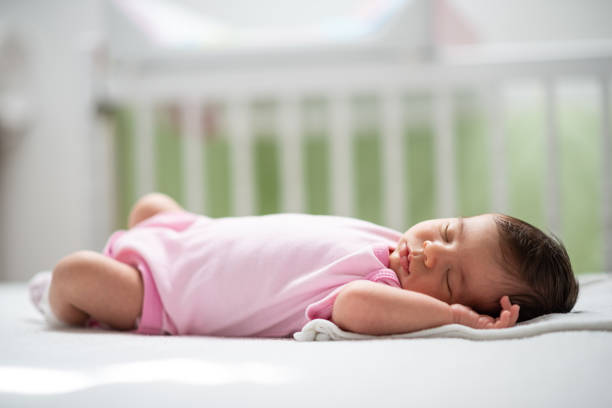 istock Sleeping newborn baby girl 1199455686