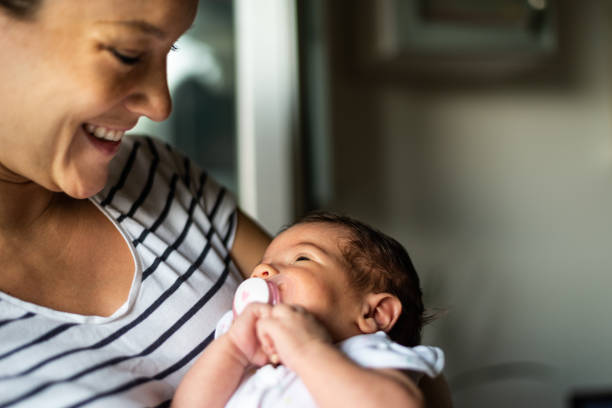 istock Mother holding newborn baby 1199455742