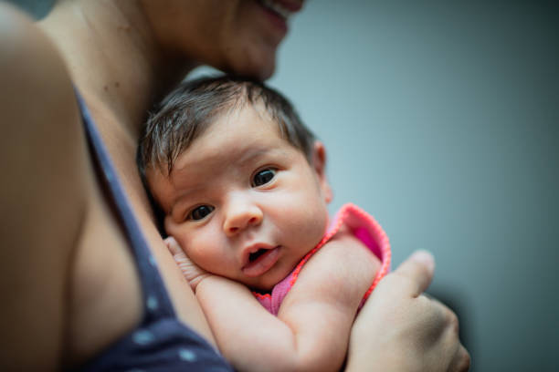 istock Mother holding newborn baby 1199455798