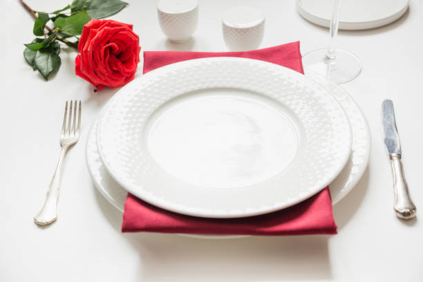 istock Valentine's day or birthday dinner. Elegance table setting with red rose and decor. 1199456339