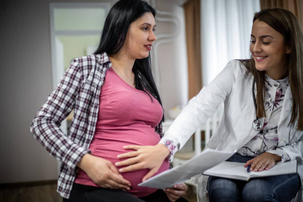 istock Pregnant woman home examination 1199456582