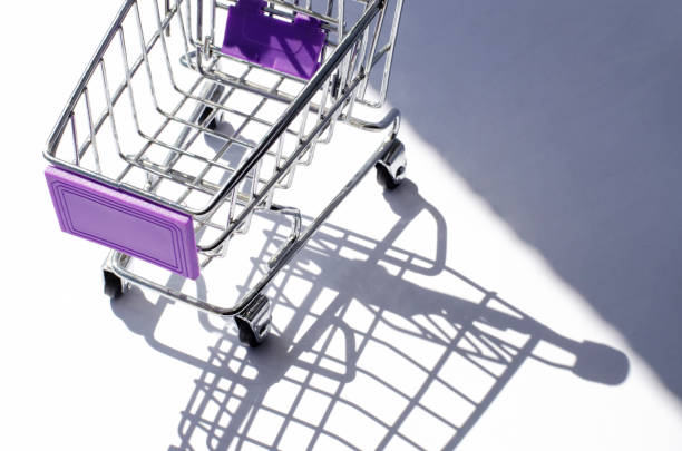 istock Mini shopping car with hard lighting and its shadow. 1199457254