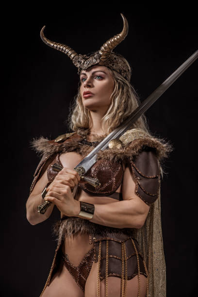 istock Blonde viking warrior female in studio shot 1199457525