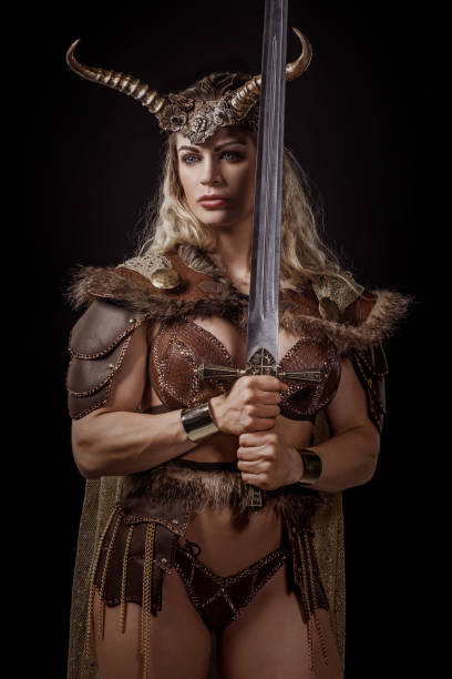 istock Blonde viking warrior female in studio shot 1199457531