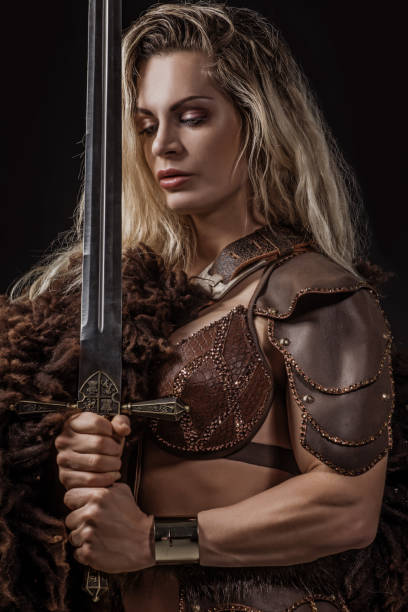 istock Blonde viking warrior female in studio shot 1199457584