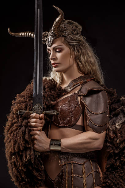 istock Blonde viking warrior female in studio shot 1199457606