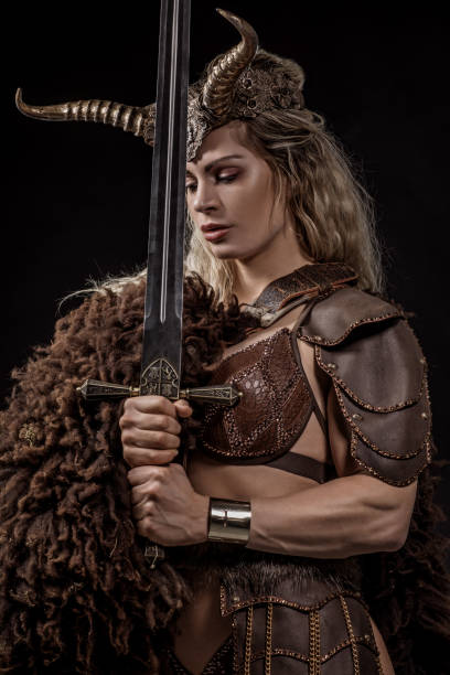 istock Blonde viking warrior female in studio shot 1199457647