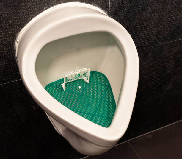 A urinal with a soccer game insert, to help men with their aim.