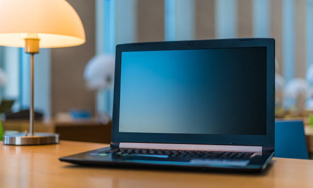 istock Laptop computer on the desk in public library 1199460268