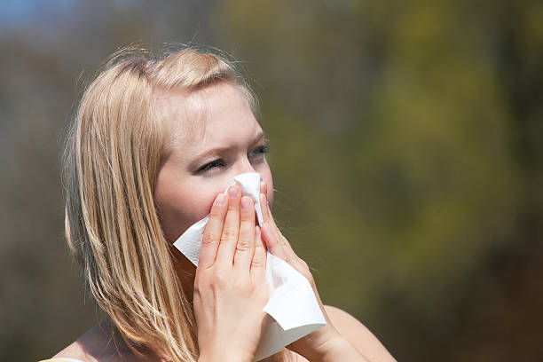 istock Woman with allergy sneezing 119946164