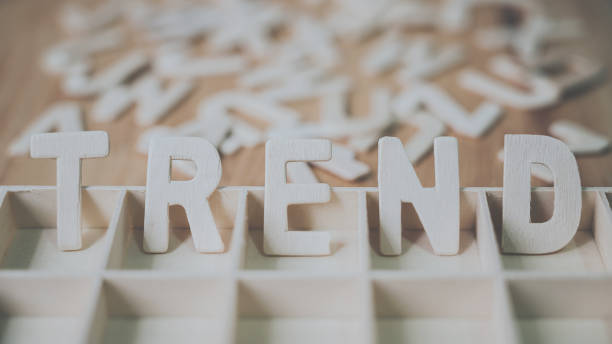 istock Wooden typography word TREND on wood table concept 1199463255