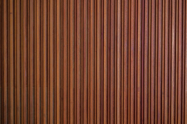 istock Brown wooden surface wall background. Wood texture vertical line 1199463303
