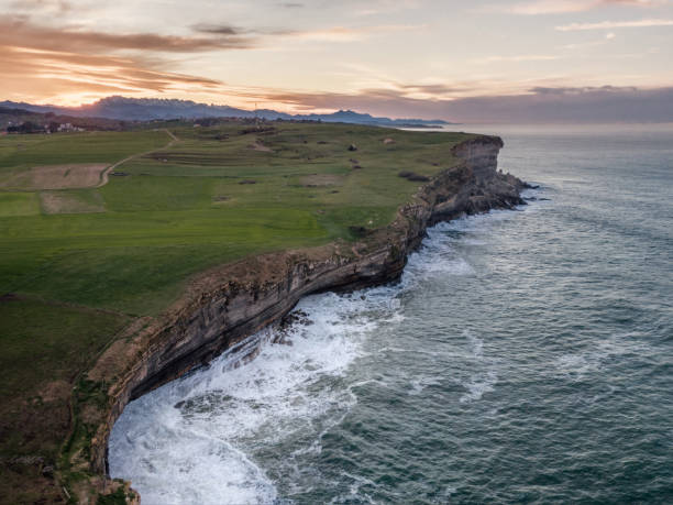 istock High cliffs by the sea at sunset as seen from above 1199465632