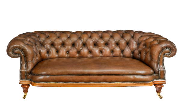 istock Classic brown leather sofa isolated on white 1199467024