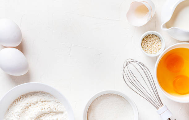 istock Frame of food ingredients for baking on a white background 1199467076