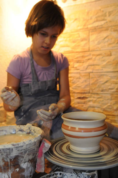 istock Girl admires her ceramics 1199474215