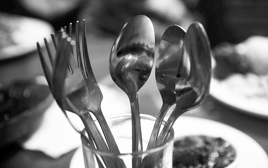Metallic spoons and forks isolated object photo