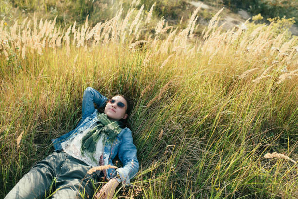Woman lying down in the wheat field