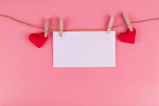 istock Red heart shape decoration hanging on line with copy space for text on pink background. Love, Wedding, Romantic and Happy Valentine day holiday concept 1199475759