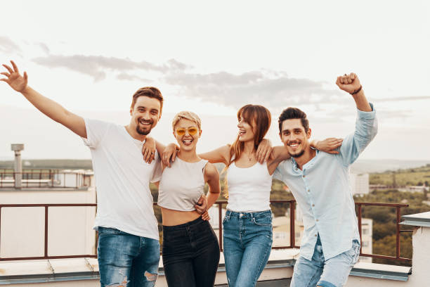 istock Group of friends enjoying outdoors at roof 1199476125