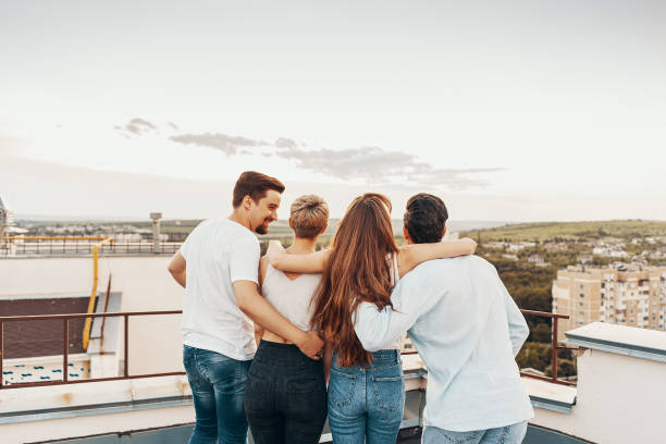 istock Group of friends enjoying outdoors at roof 1199476160