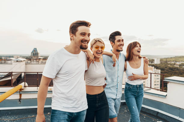istock Group of friends enjoying outdoors at roof 1199476172