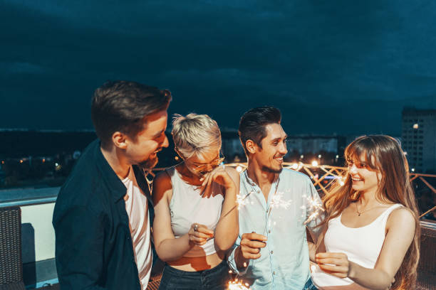 istock Friends enjoying a rooftop party 1199476199