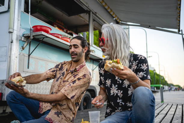 istock Two macho men enjoying barbecue together 1199476298