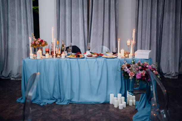 istock Burning candles on a festive table. A festive table with candles 1199477222