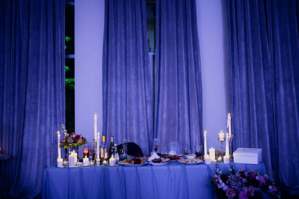istock Burning candles on a festive table. A festive table with candles 1199477232