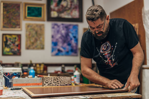 istock Artist preparing canvas in art studio 1199477510