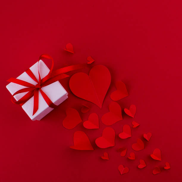 istock Valentine's day abstract background with paper cut red hearts decoration, flat layout, empty space for text 1199478566