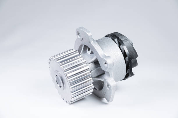 istock New metal automobile pump for cooling an engine water pump on a gray background with a gradient. The concept of new spare parts for the car engine 1199478607