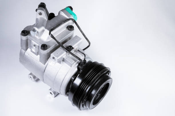 istock Close-up New car air conditioning compressor on grey background 1199478799