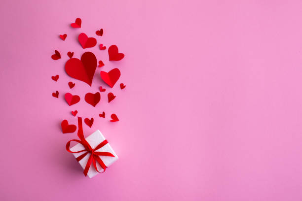 istock Valentine's day abstract background with paper cut red hearts decoration, flat layout, empty space for text 1199478813