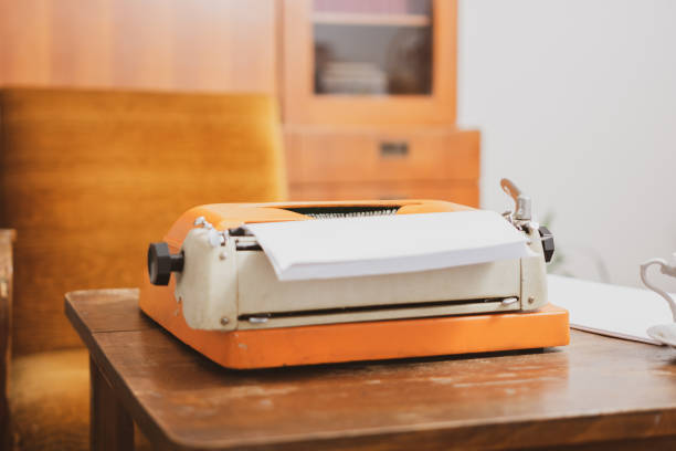 istock Old typewriter on the wooden table. 1199479911