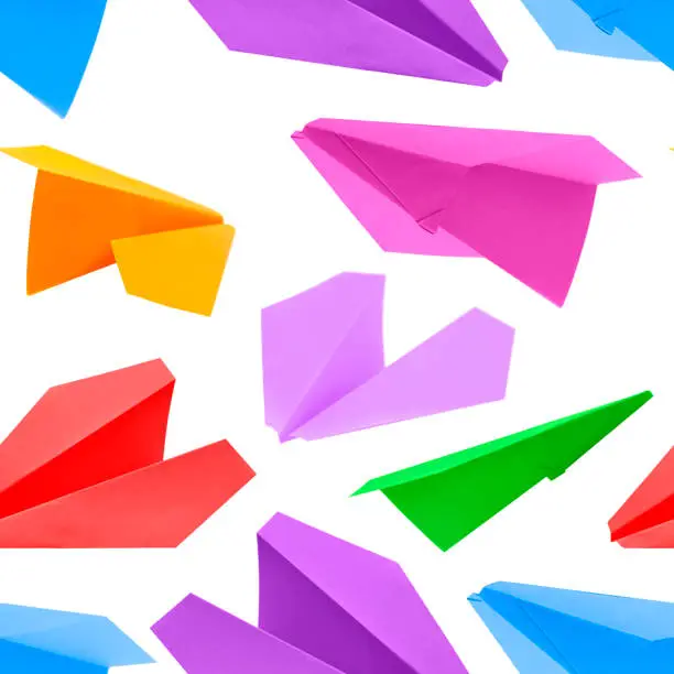 Photo of paper plane made of color paper background