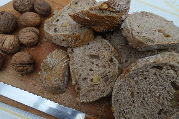 istock Sliced nut bread on a wooden cutting board 1199481245