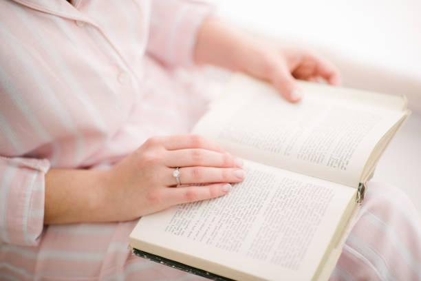 istock woman reading a book close up 1199482635