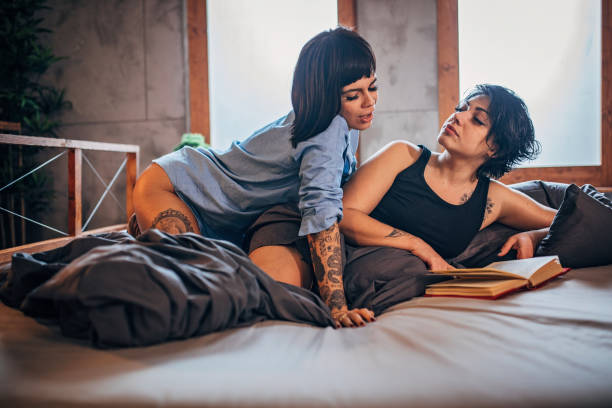 istock Beautiful couple is reading a book 1199482928