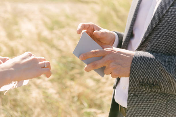 istock A person holds a greeting card and reads it. 1199485957