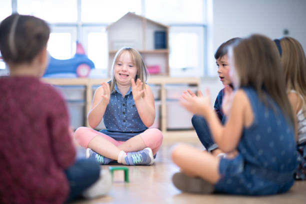 istock Kindergarten Class Singing and Clapping During Circle Time stock photo 1199489138