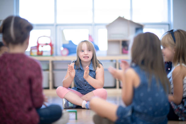 istock Kindergarten Class Singing and Clapping During Circle Time stock photo 1199489139