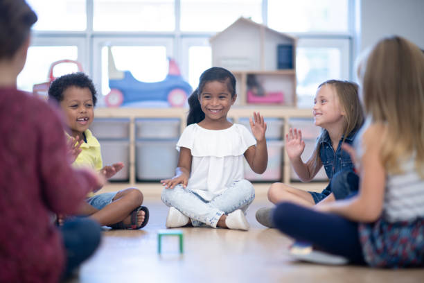 istock Kindergarten Class Singing and Clapping During Circle Time stock photo 1199489141