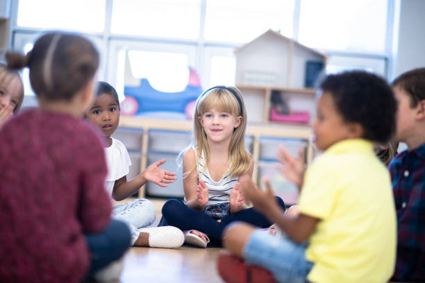 istock Kindergarten Class Singing and Clapping During Circle Time stock photo 1199489146